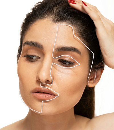 Woman with facial treatment zones drawn on her face