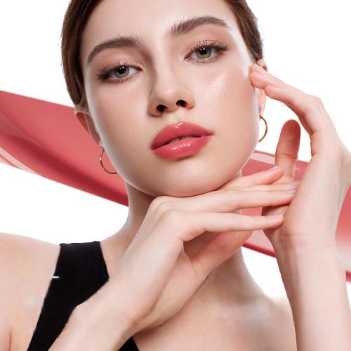 Client with smooth skin touching her jawline