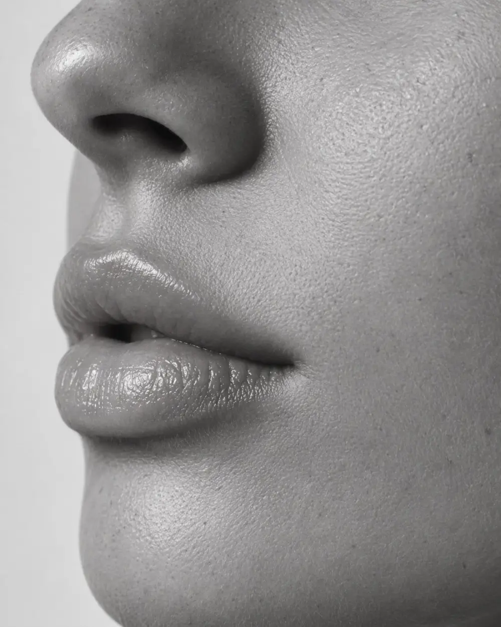 Close-up of natural-looking lips in black and white
